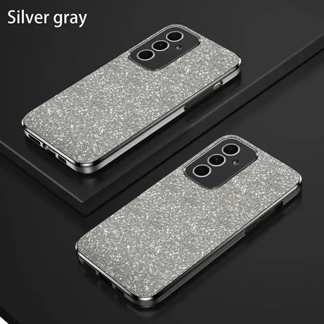 A pair of silver glitter cases on a black surface