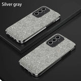 A pair of silver glitter cases on a black surface