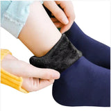a person putting a pair of socks