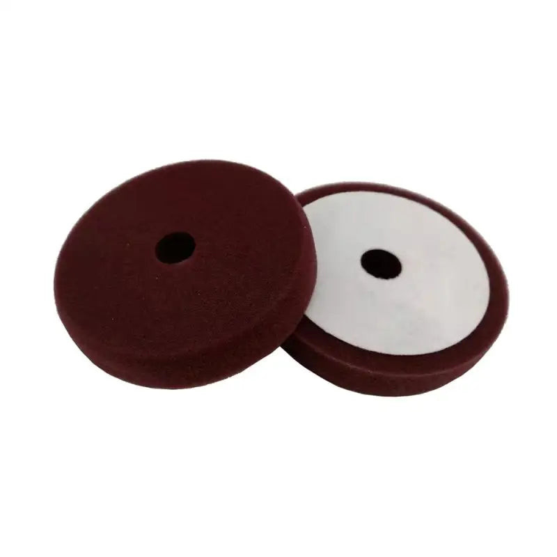 a pair of brown and white buttons