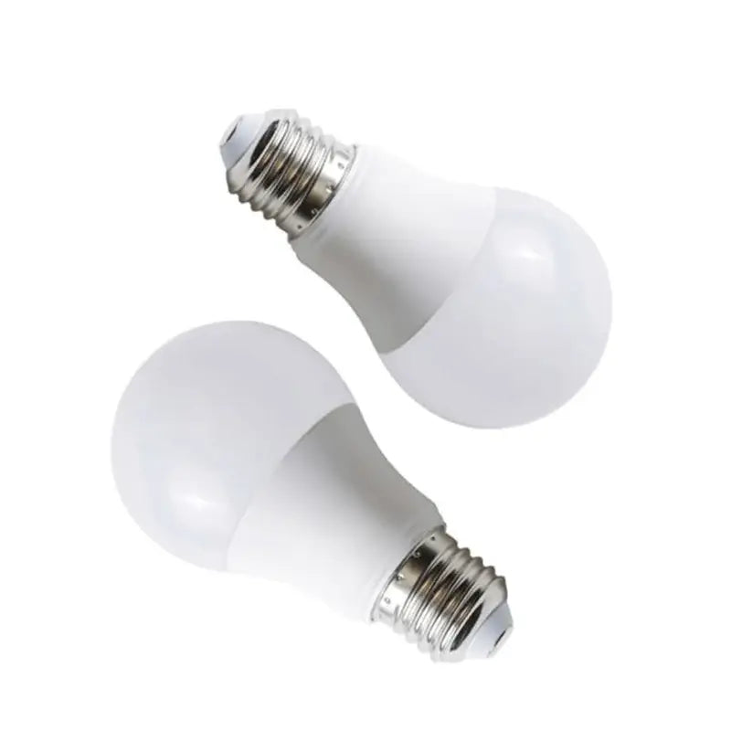 a pair of white light bulbs on a white background