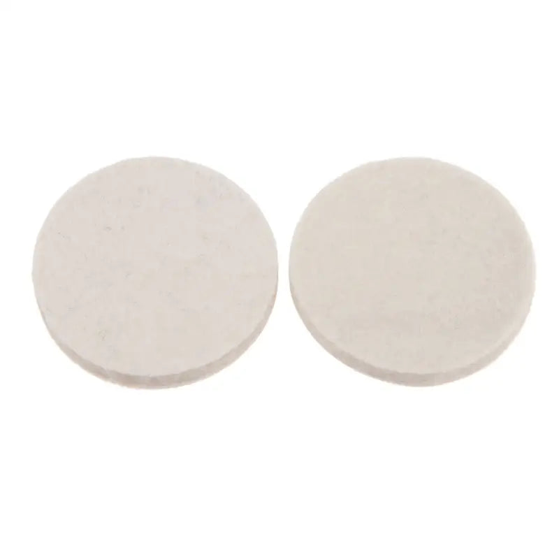 a pair of white ceramic discs