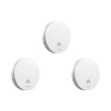 a pair of white round knobs with a white arrow on the front