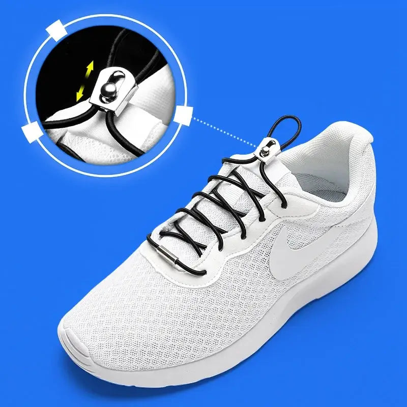 a pair of white shoes with black laces and a black shoelacet