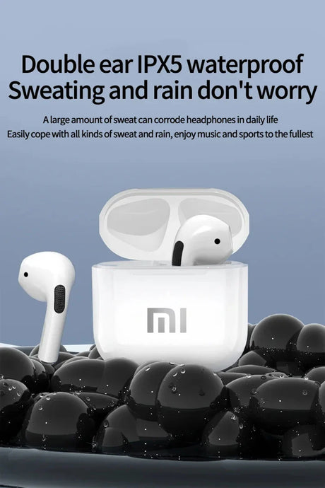 Pair of white wireless earbuds in an open charging case with ’mi’ branding.