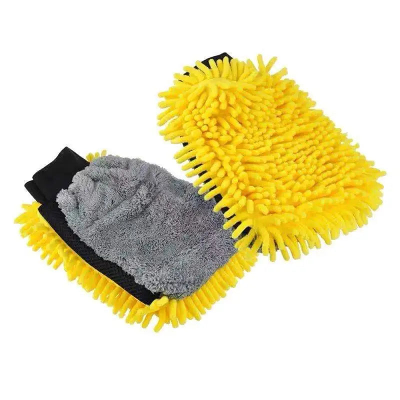 a pair of yellow and black cleaning gloves with a black glove