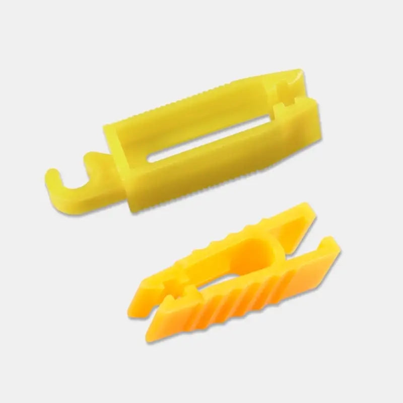 a yellow plastic connector with a white background
