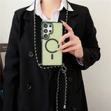 Pale green phone case with a black cord strap.