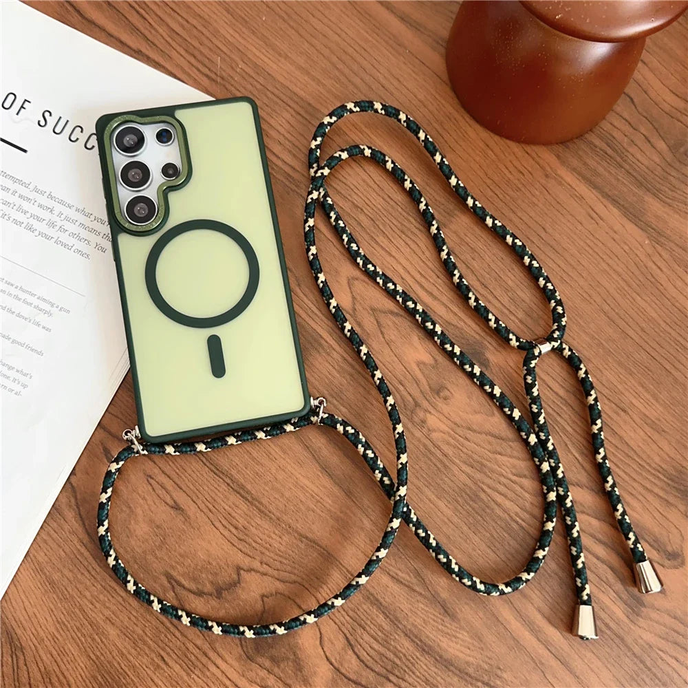 A pale green phone case with a dark green border and a black magnetic ring, attached to a black and white braided rope strap.