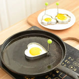 a pan with eggs on it sitting on a wooden table