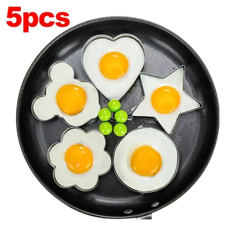 a pan with four eggs in it