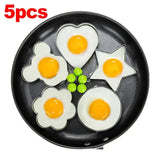 a pan with four eggs in it