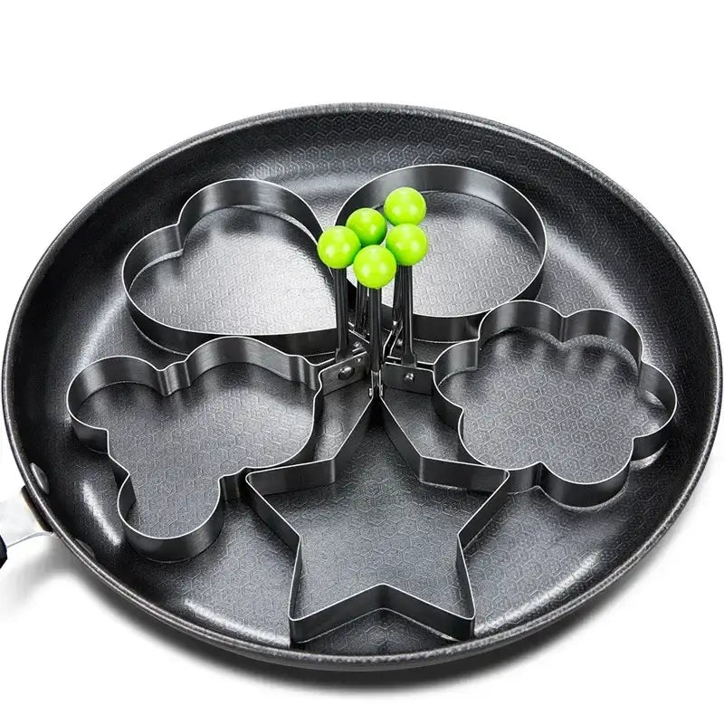 a pan with four green apples in it