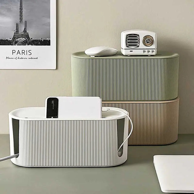 a white and black speaker sitting on top of a table