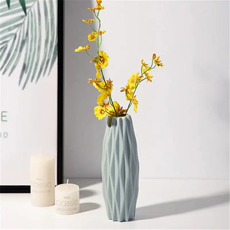 a vase with yellow flowers in it