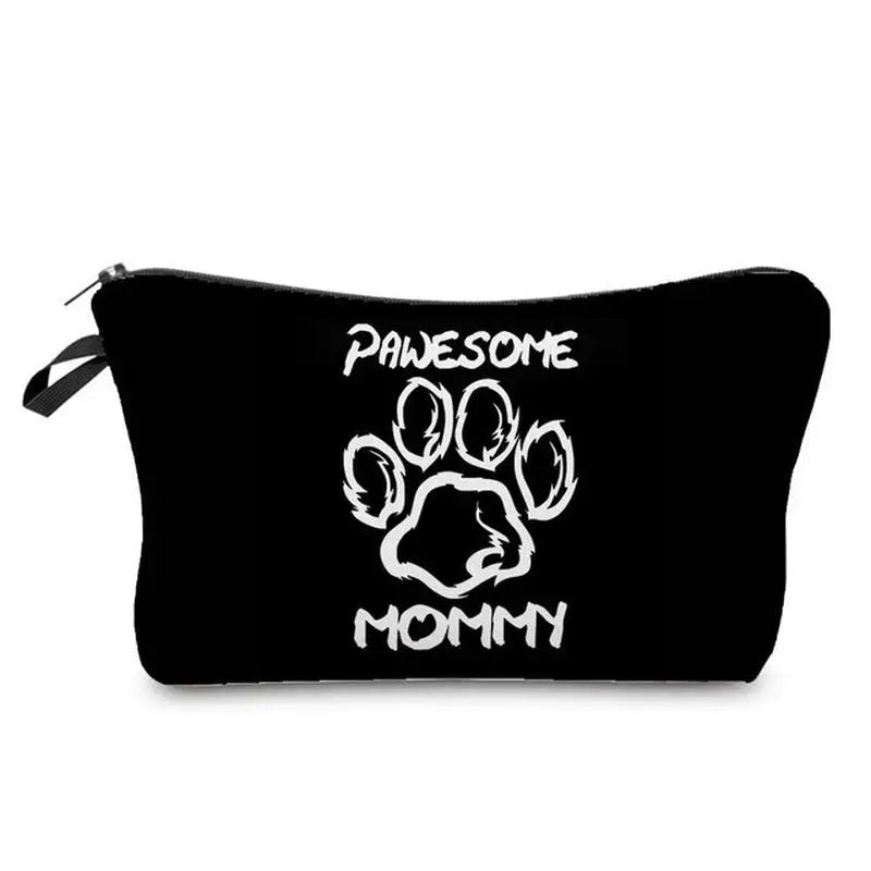 a black zipper bag with a white dog’s face and paws on it