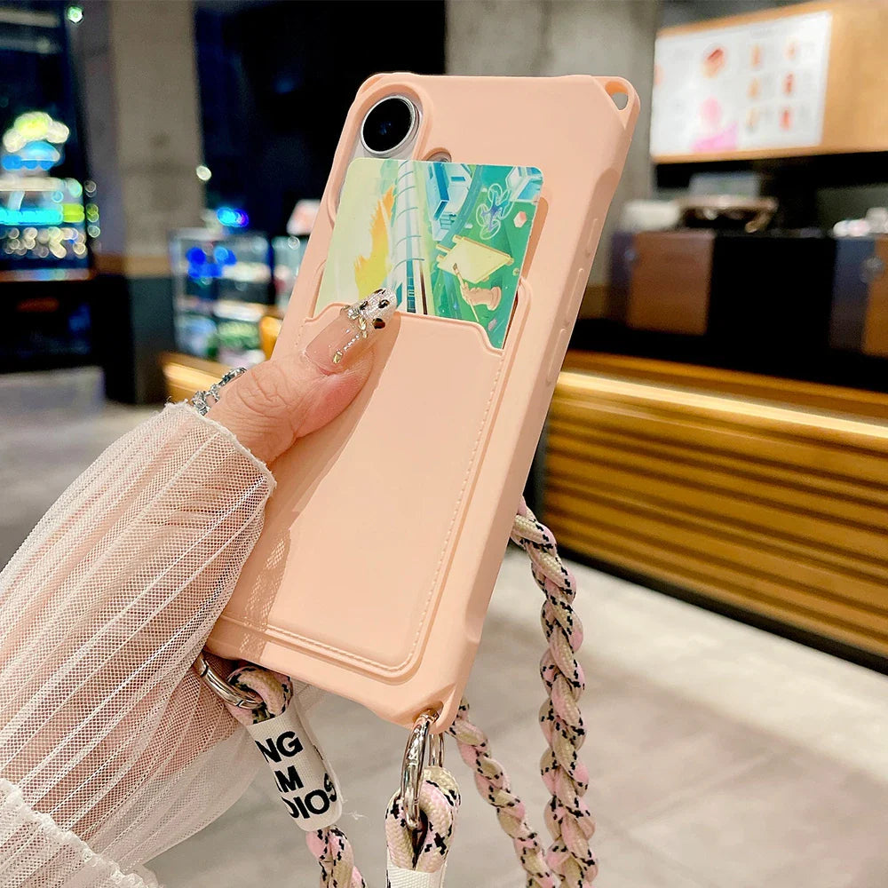 Peach-colored phone case with card holder and lanyard.