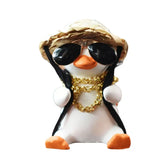 a penguin wearing sunglasses and a hat