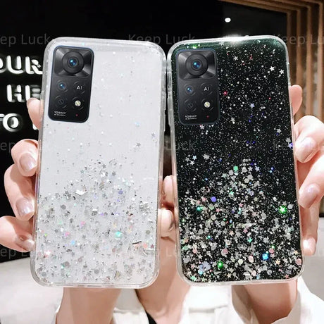 a woman holding up a phone case with glitter