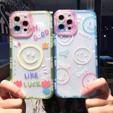 two people holding up their phone cases with smiley faces