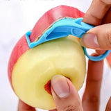 a person is peeling an apple with a knife