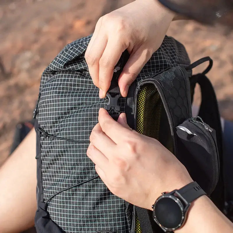 a person putting a backpack strap on their backpack