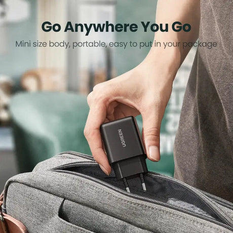 A person holding a bag with a usb attached to it