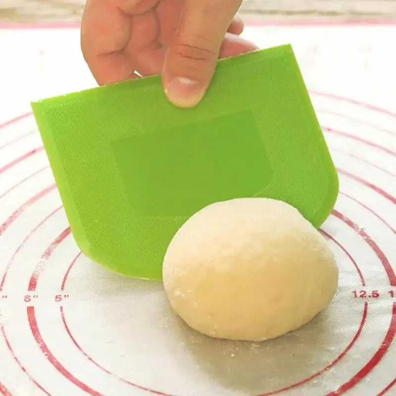 a person is putting a ball of dough into a circle