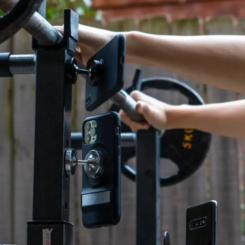 a person using a barbell machine to pull a barbell