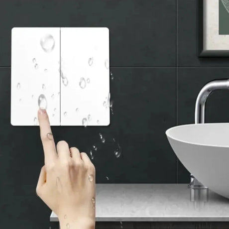 A person pointing at a bathroom sink