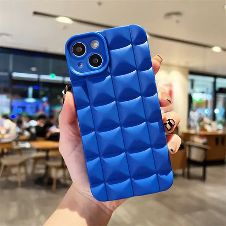 A person holding a blue iphone case