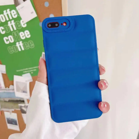 A person holding a blue iphone case