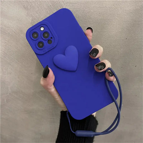 A person holding a blue phone case with a heart