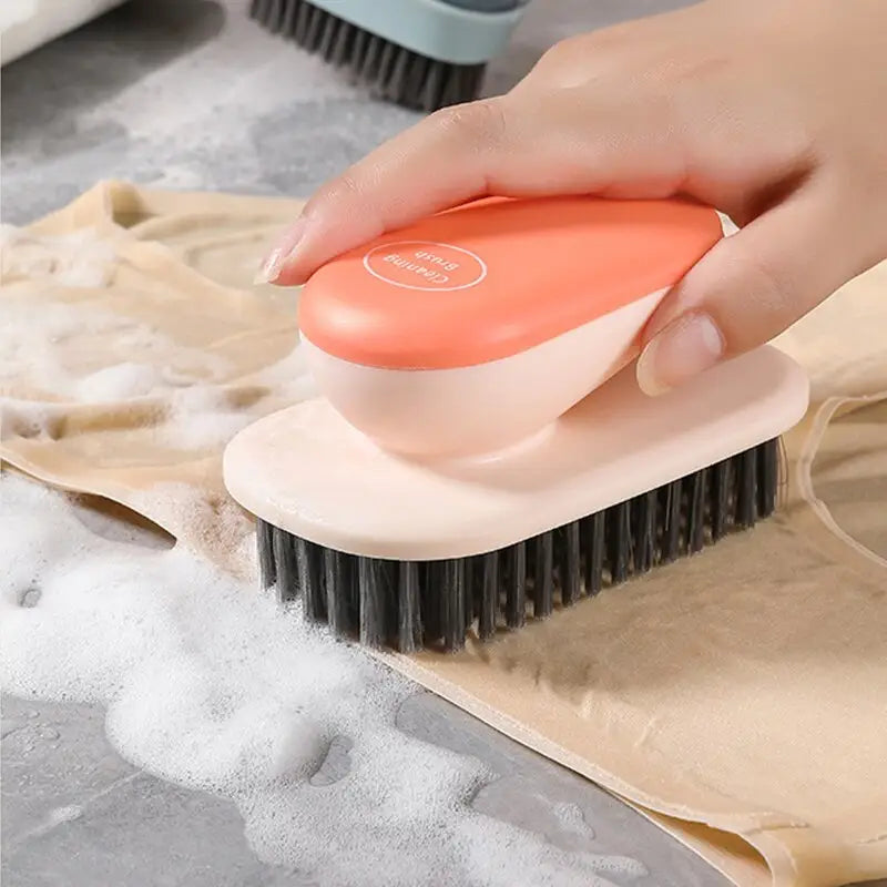 a person using a brush to clean a dish