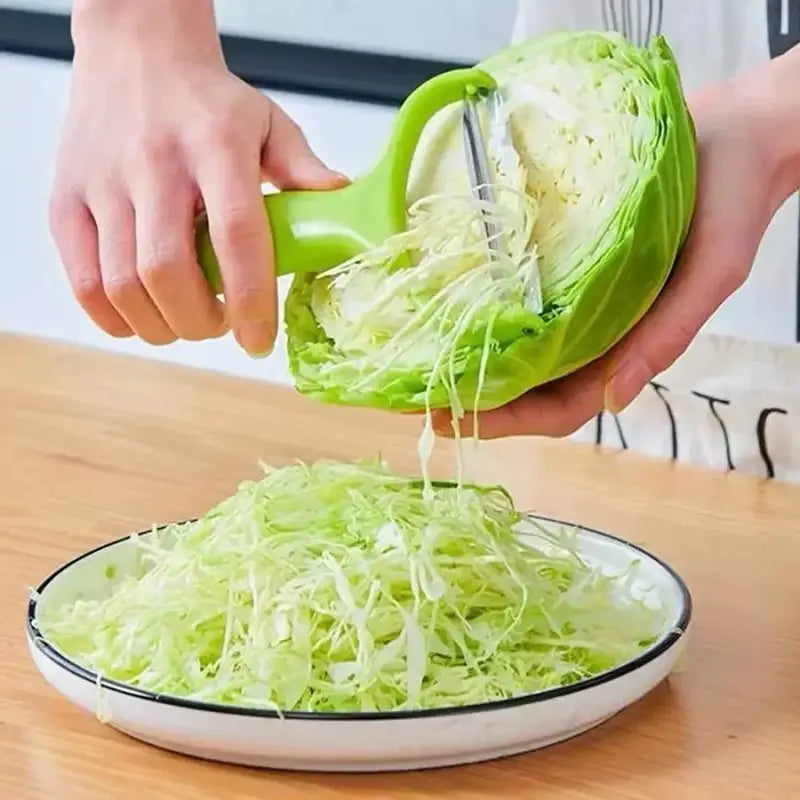a person is cutting cabbage into a bowl