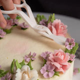 a person cutting a cake with a knife