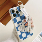 A person holding a cell case with a phone