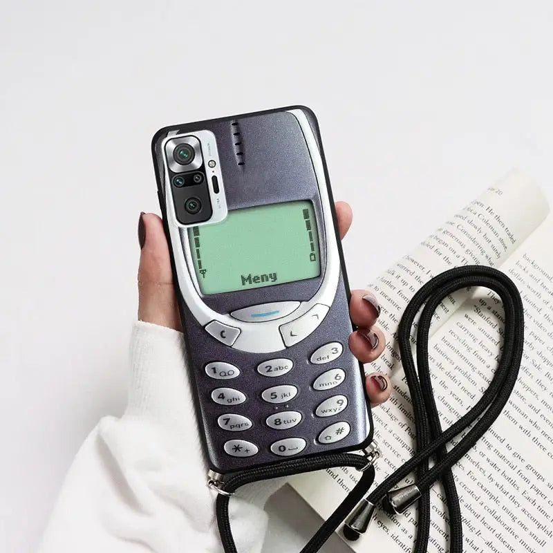 a person holding a cell phone in their hand