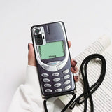 a person holding a cell phone in their hand
