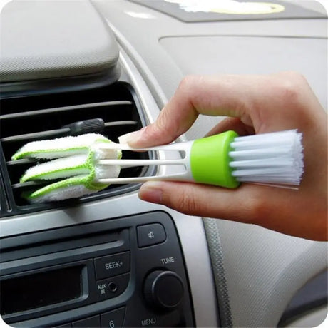 a person cleaning a car with a brush