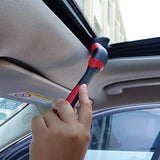a person is cleaning the car with a brush