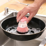 a person cleaning a pan with a brush