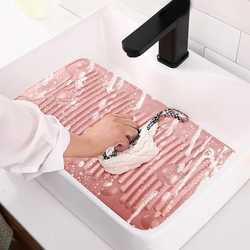a person is using a brush to clean a pink marble