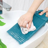 a person cleaning a sink with a sponge