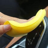 a person is cleaning a banana in a car