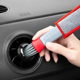 a person cleaning a car with a sponge