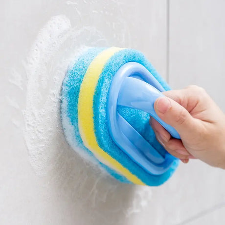 someone cleaning a wall with a sponge