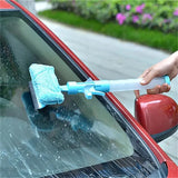 a person cleaning a car with a sponge