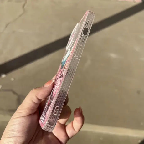 a person holding a clear case with a pink and blue design