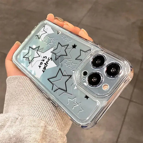 A person holding a clear case with stars on it